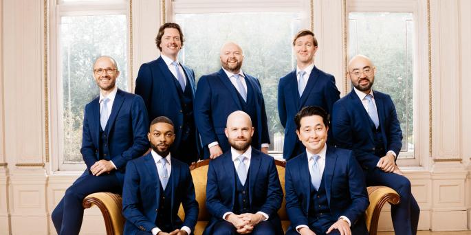 8 Cantus vocalists in blue suits