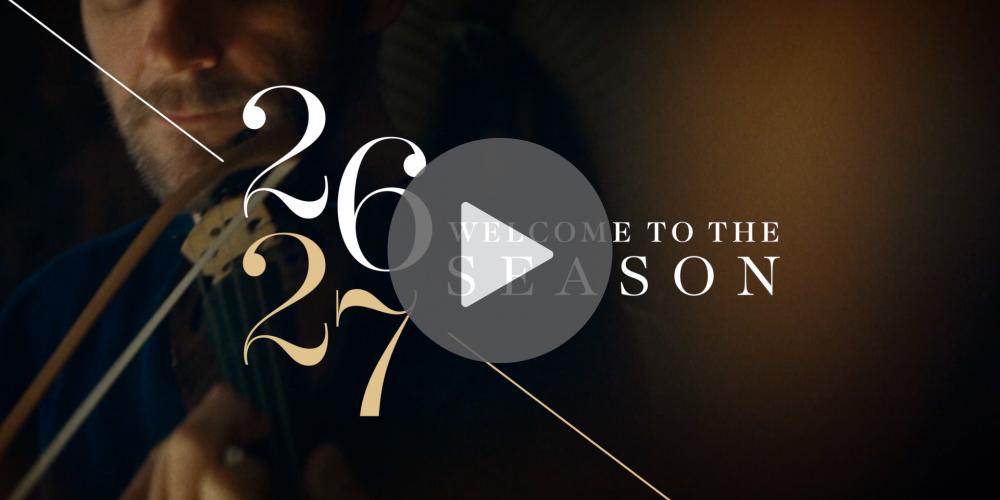 A sepia-toned photo of someone playing a violon with the words "Welcome to the 26-27 Season" on top.